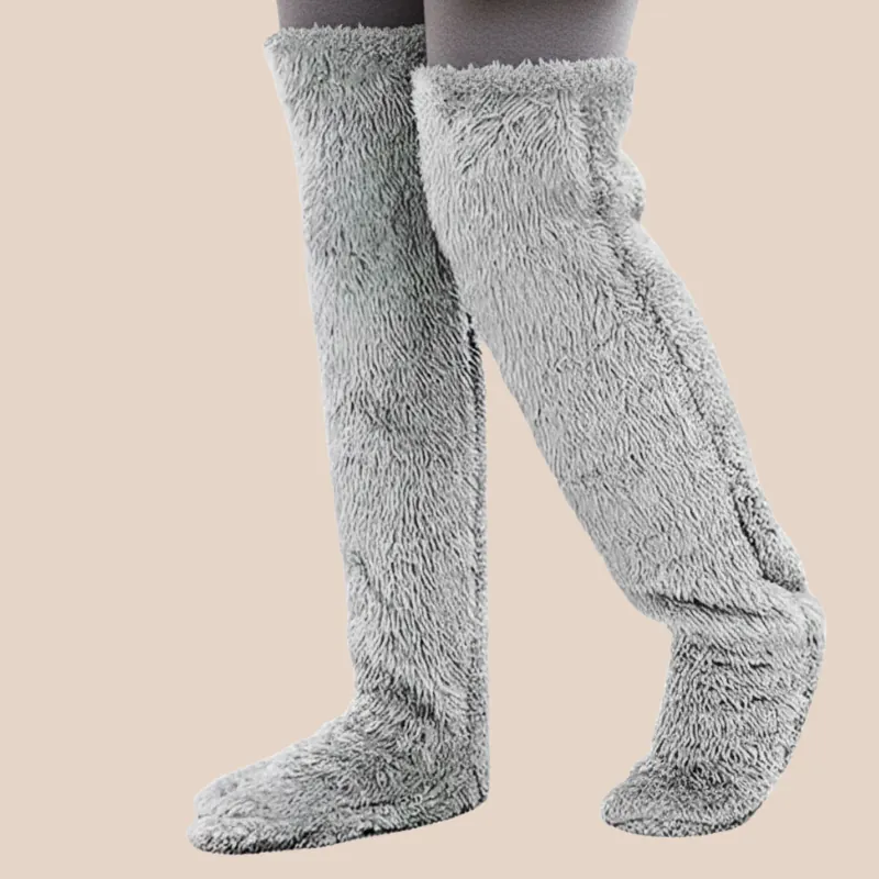 Close-up of plush Classic Grey fleece over-the-knee leg warmers showing the soft, blanket-like texture